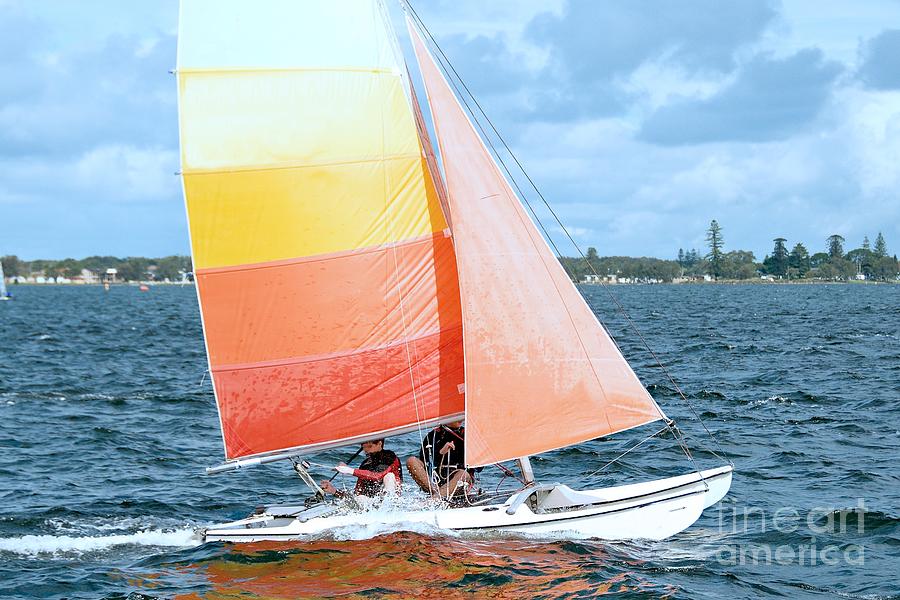 Children Sailing racing boats. Photograph by Geoff Childs