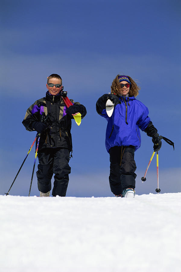 Children skiing Photograph by Comstock Images
