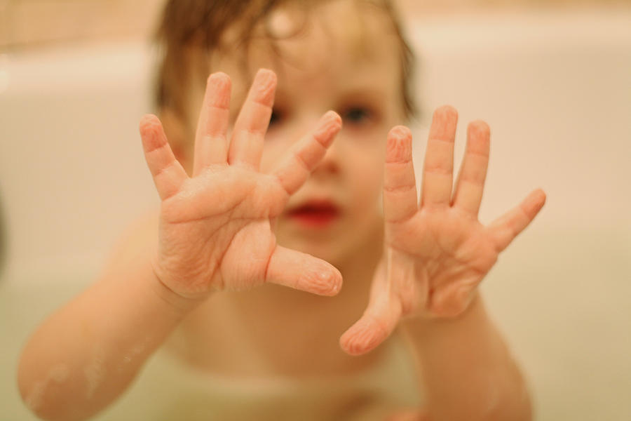 Childs wrinkled palms after a warm bath Photograph by Ramune Golysenkiene