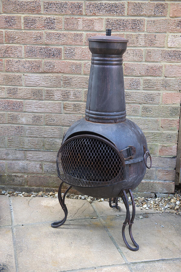 Chiminea In Back Yard Photograph by Stevechatterton