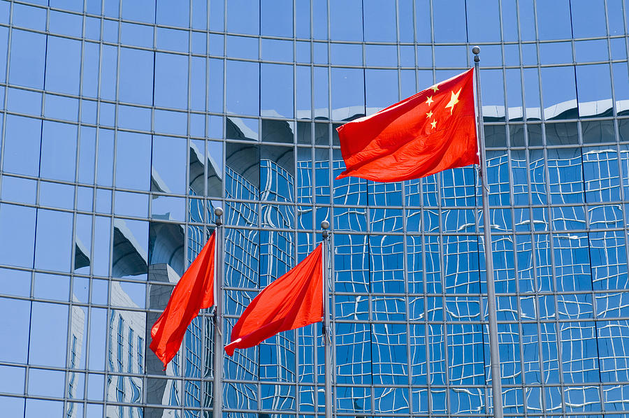 China, Beijing, Flag in front of Grand Hyatt Hotel Photograph by Karin Slade