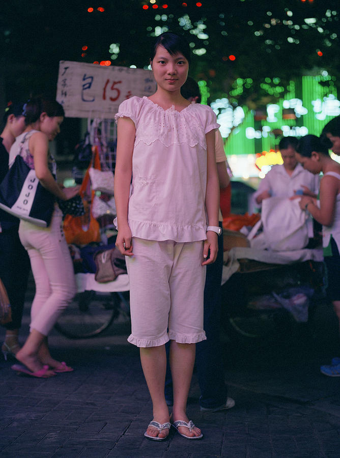 China, Shanghai, teenage girl on street, night, portrait Photograph by xPACIFICA