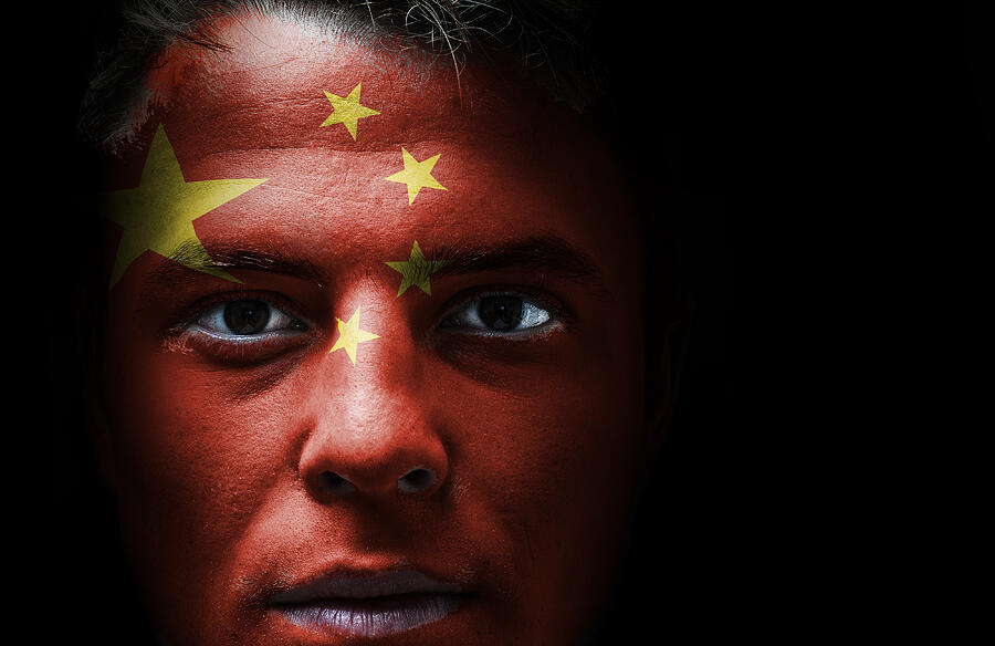 Chinese flag on face Photograph by Filograph