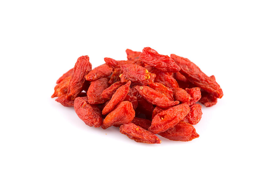 Chinese goji berries close up on white background Photograph by R.Tsubin