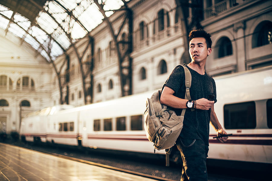 Chinese hipster man on a station Photograph by South_agency