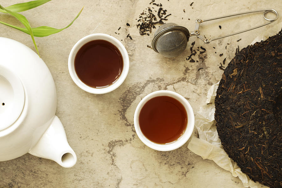 Chinese tea. Pu erh Puerh Tea Cake. Photograph by AnjelaGr