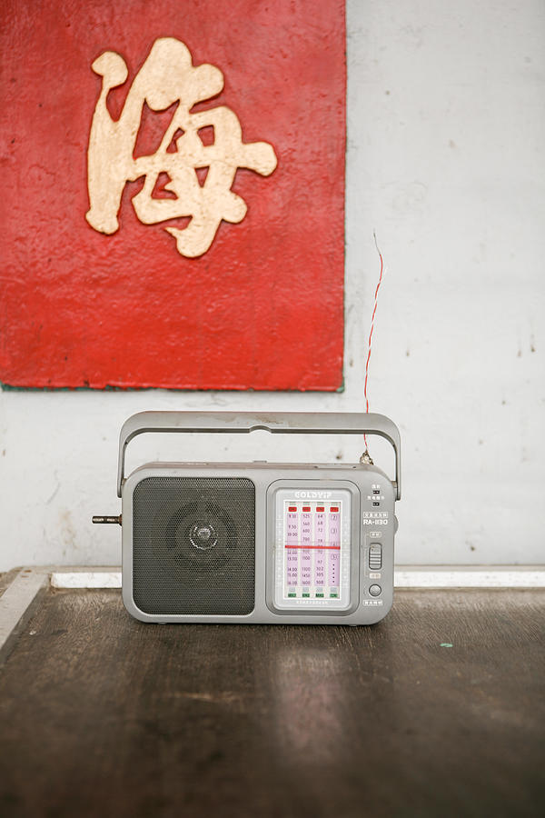 Chinese transistor radio on table Photograph by Merten Snijders