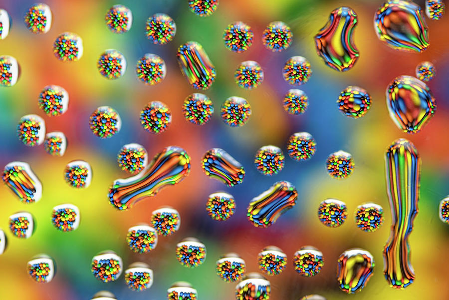 Chocolate Candies Reflected Through Water Droplets On Glass Photograph