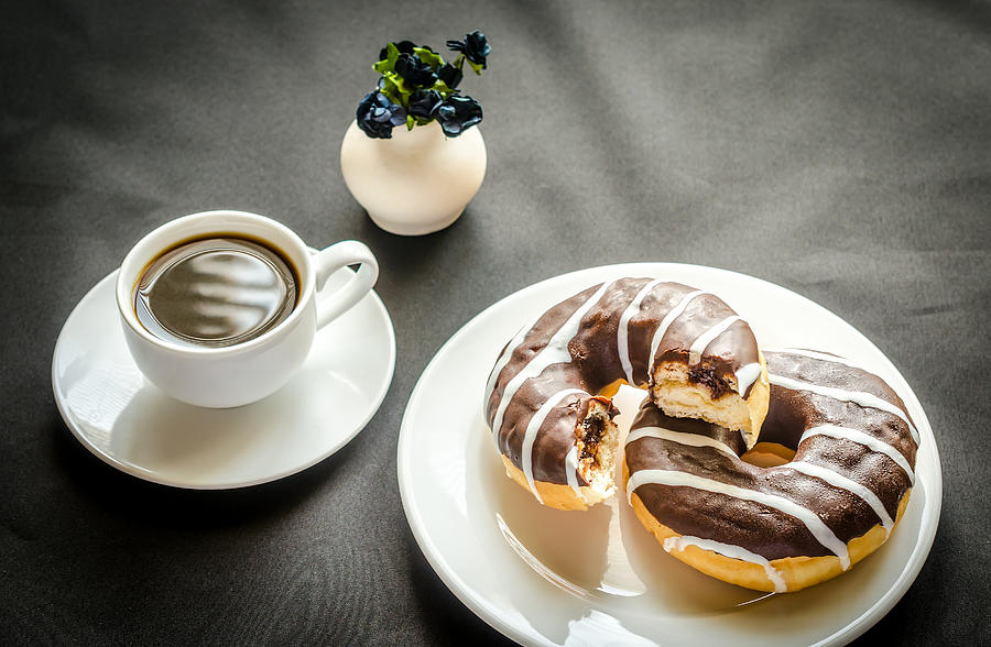 Chocolate donuts with a cup of coffee Photograph by AlexPro9500