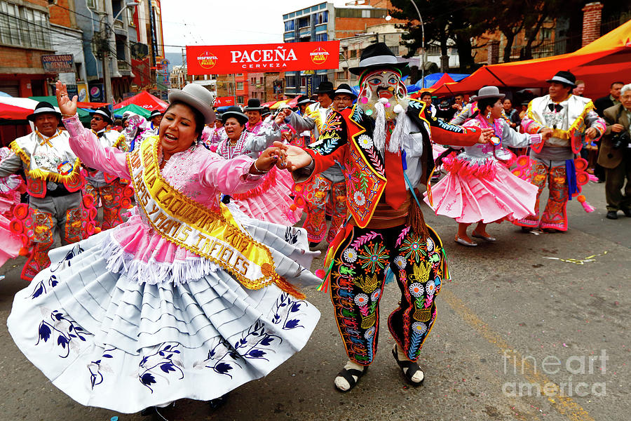 Cholita and chuta dancing during La Paz Carnival Bolivia Photograph by James Brunker