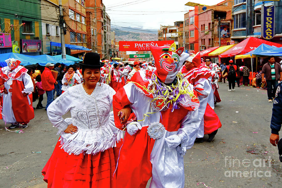 Cholita and pepino dancing at La Paz Carnival parades Bolivia Photograph by James Brunker