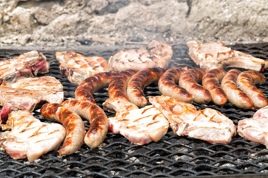 Chops and pork sausages cooked on the barbe Photograph by Jean-Marc PAYET