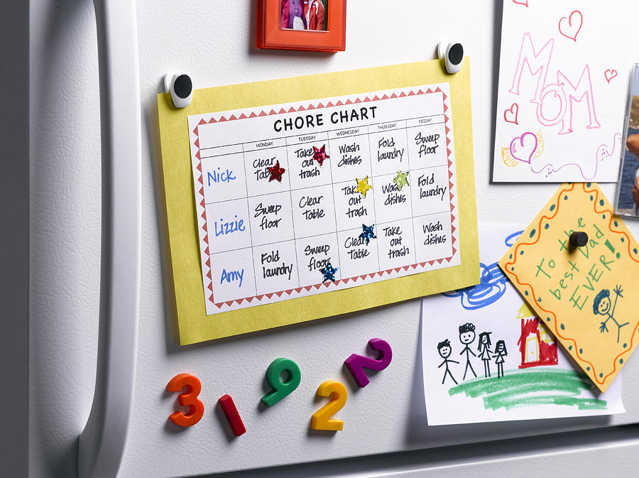 Chore Chart on Refrigerator Photograph by Jeffrey Coolidge