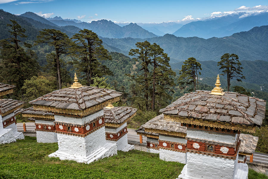 Chortens and mountains at Dochula Pass, Bhutan Photograph by © Pascal Boegli