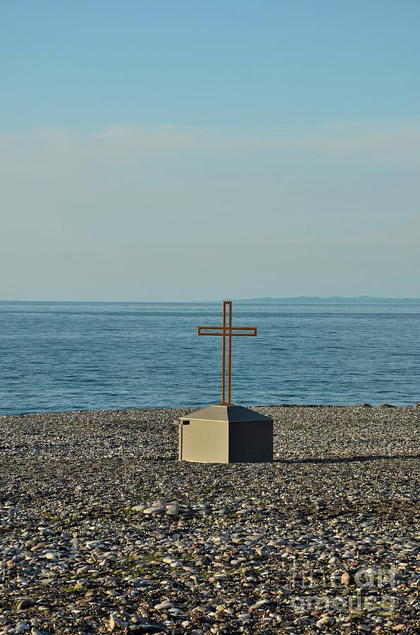 Pebbles Photograph - Christian cross crucifix on rocky Black Sea beach seafront Batumi Georgia by Imran Ahmed