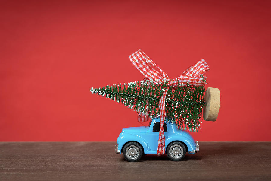 Christmas Background Concept With Christmas Tree On Toy Car.  Christmas Celebration. Photograph