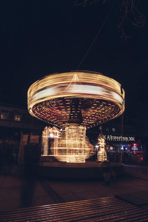 Christmas carousel on the streets of Warsaw. Fire Wheel Photograph by Vaclav Sonnek