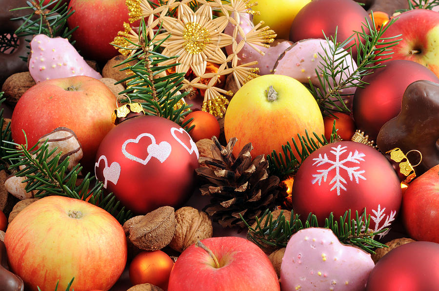 Christmas decoration with baubles apples nutes and cookies Photograph by Hsvrs