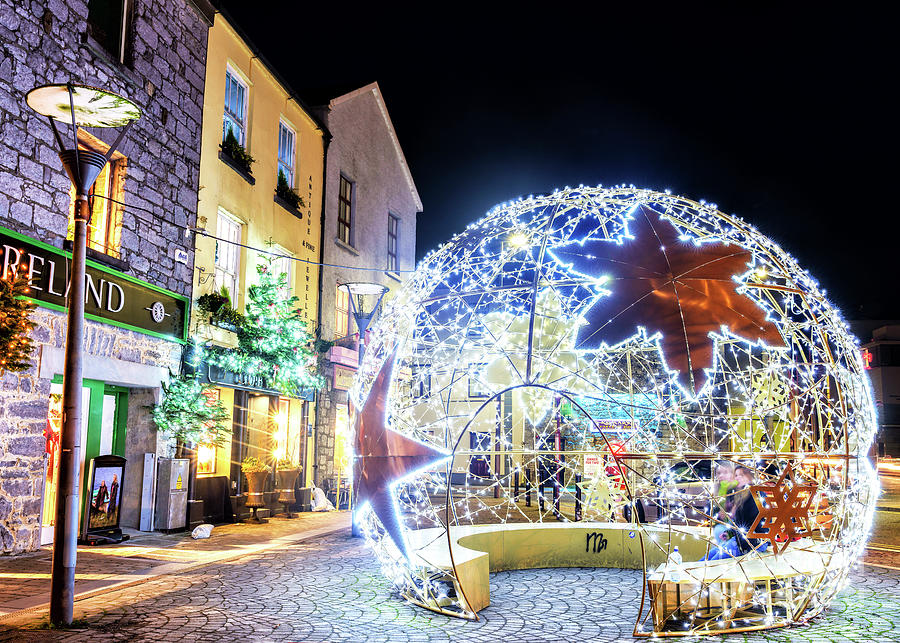 Christmas Globe in Galway Ireland Photograph by John Rizzuto