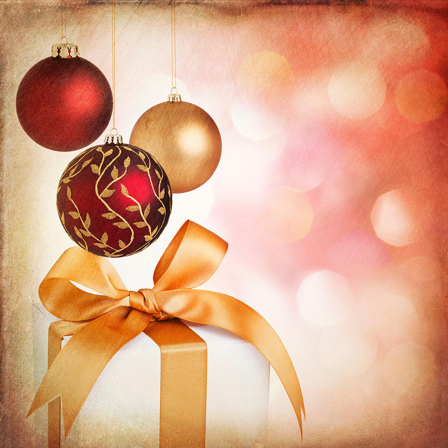 Christmas holiday gifts and baubles with textured Christmas background Photograph by Lisa Thornberg