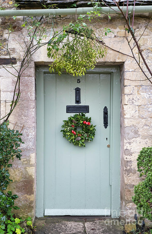 Christmas Holly Wreath and Mistletoe in Bibury Photograph by Tim Gainey