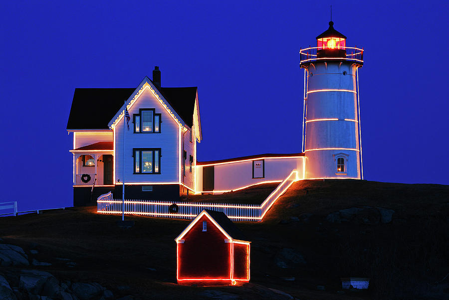 Christmas Lights on the Nubble Lighthouse Photograph by James Kirkikis