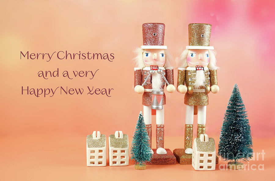 Christmas nutcracker ornaments and gifts against a modern coral  Photograph by Milleflore Images