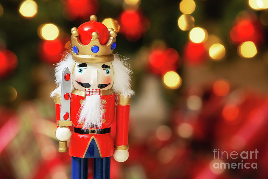 Christmas nutcracker with Christmas tree bokeh background Photograph by Leena Robinson