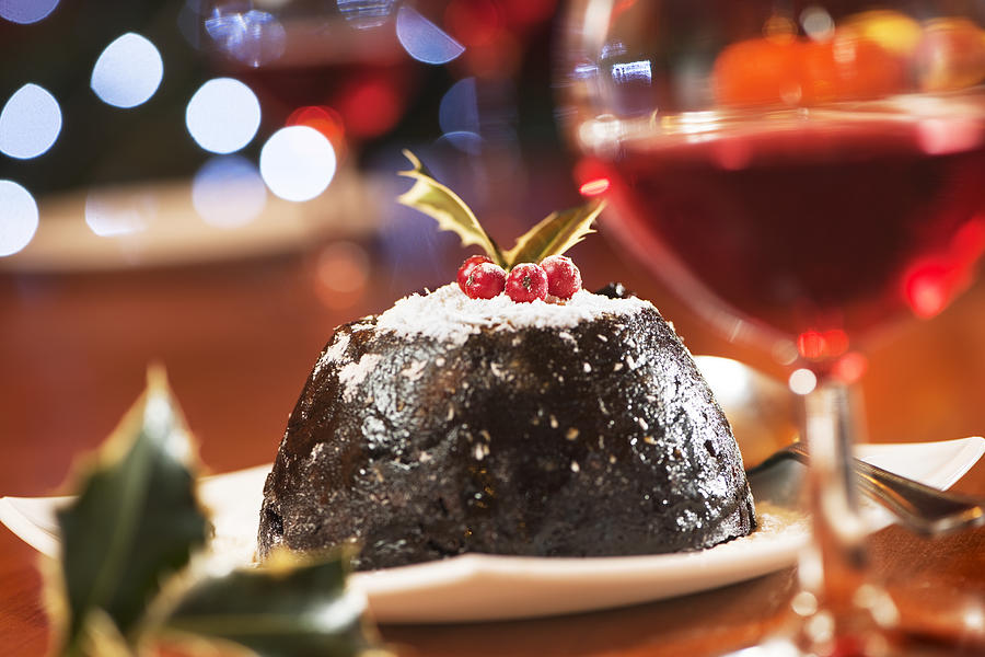 Christmas pudding and wine in warm colours scene Photograph by Esp_imaging