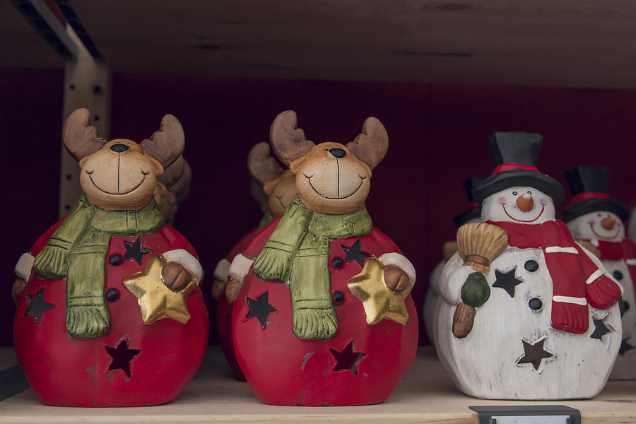 Christmas reindeers and snowman for sale in a Christmas market Photograph by Laura Battiato