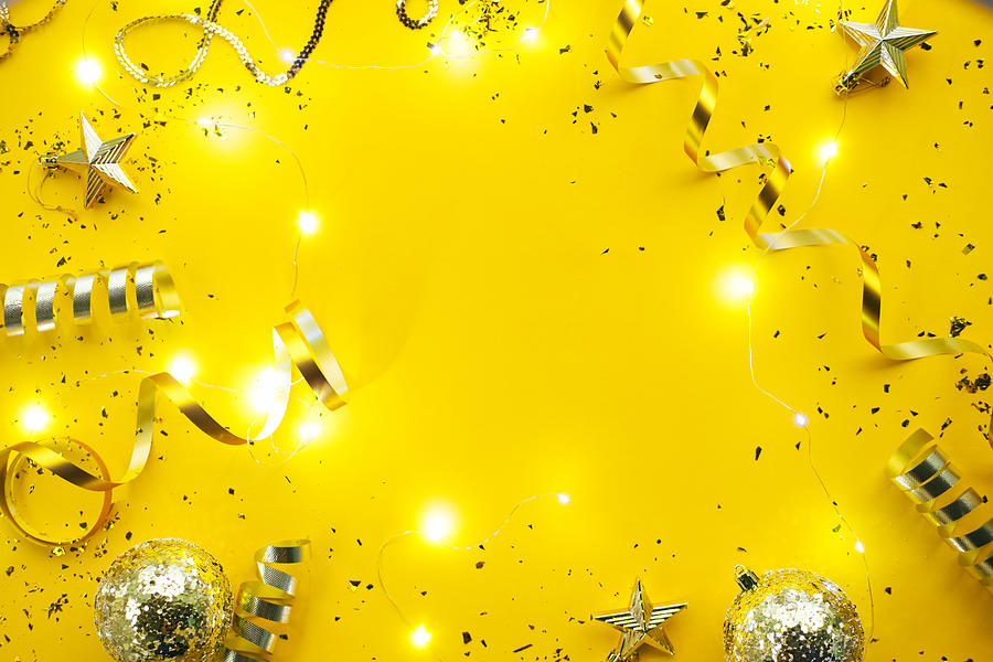 Christmas stylish decorations on yellow background. New Year coming concept Photograph by Anna Efetova