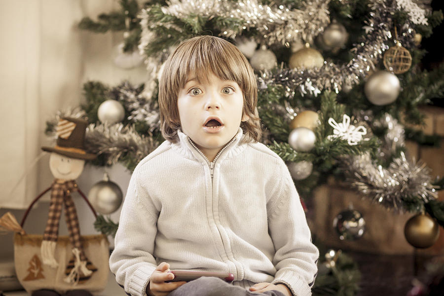 Christmas surprised boy Photograph by Destinations by DES - Desislava Panteva Photography