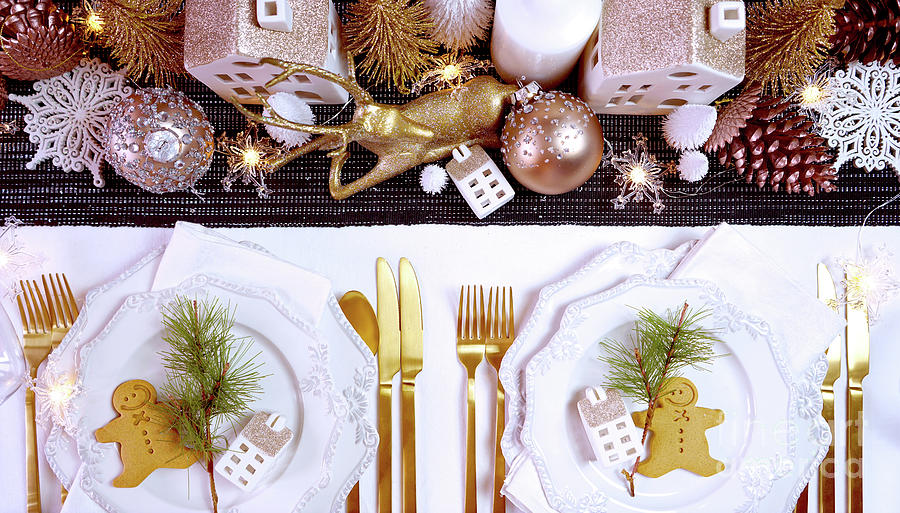 Christmas Photograph - Christmas table with gold centerpiece and elegant fine china tableware. by Milleflore Images