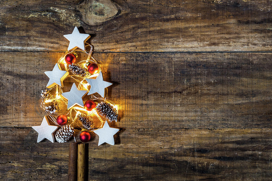 Christmas tree decoration with red baubles, white star shapes ...