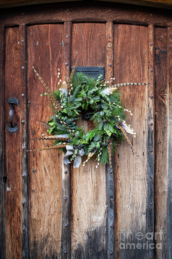 Christmas wreath on an Old Oak Door Photograph by Tim Gainey
