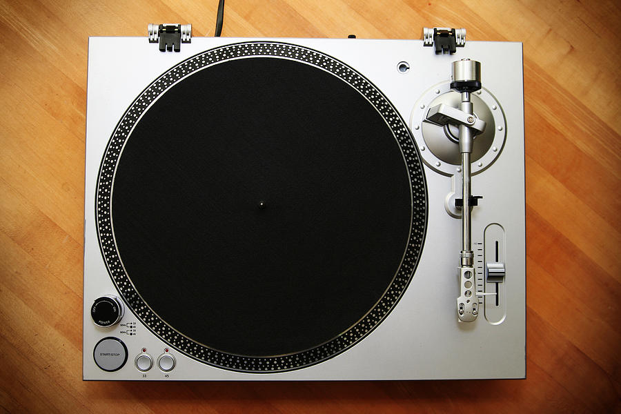 Chrome Turntable / Record Player on Wood Background Photograph by RyanJLane