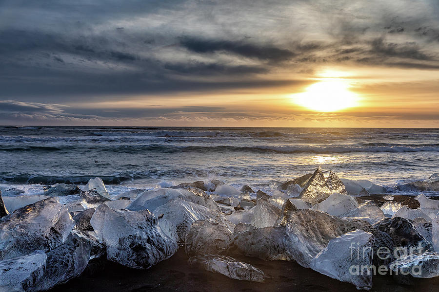 Chucks of ice on Diamond Beach, Iceland, at sunrise Photograph by Jane Rix