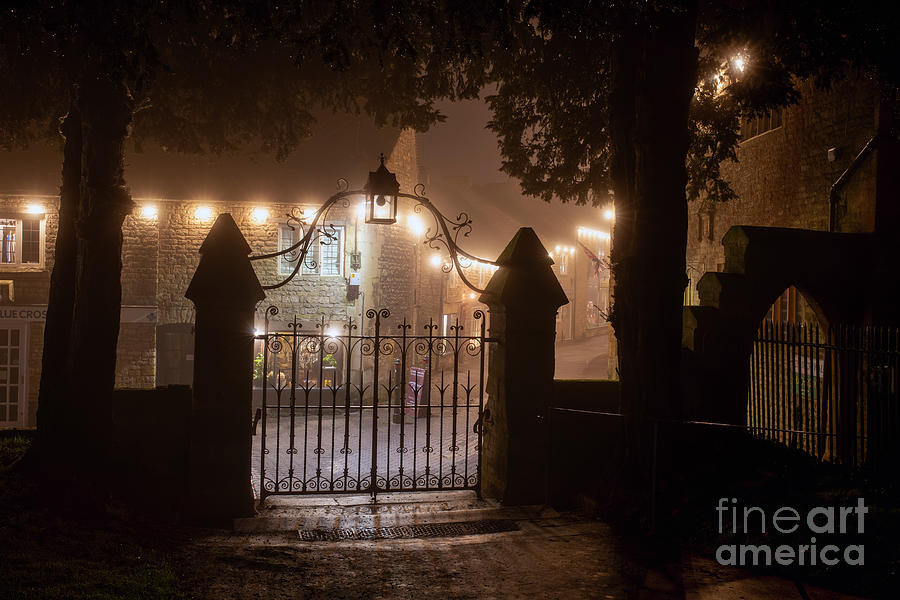 Church Gates in Stow on the Wold on a Misty Christmas Night Photograph by Tim Gainey
