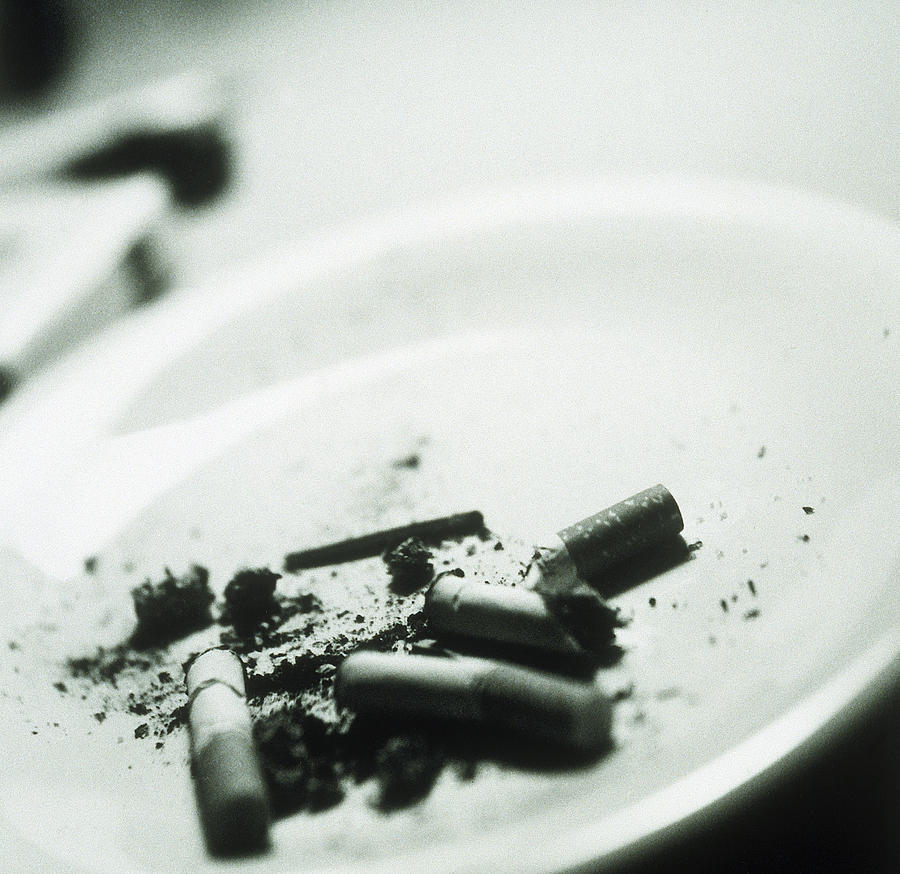 Cigarette butts Photograph by Dora Handel