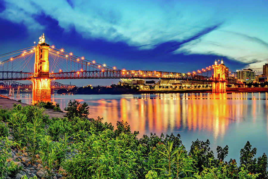 Cincinnati Reds Photograph - Cincinnati John A. Roebling Bridge at Dusk Along The Ohio River Shoreline by Gregory Ballos