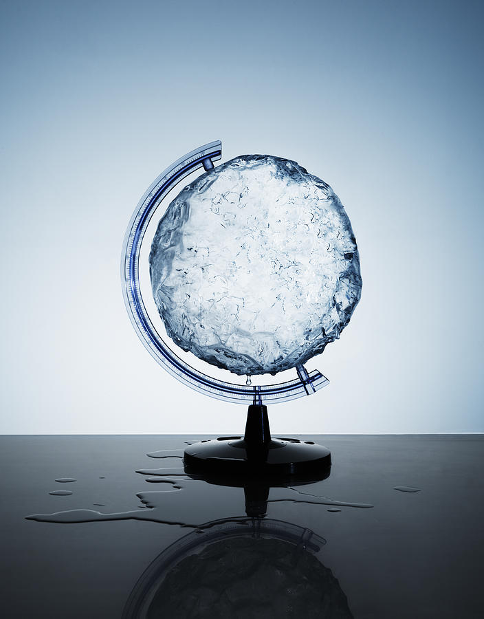 Circular ice block in a globe support holder Photograph by Henrik Sorensen
