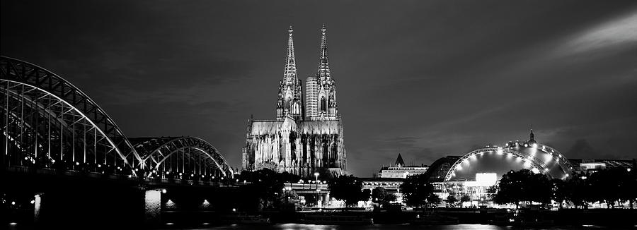 City at dusk, Musical Dome, Cologne Cathedral, Hohenzollern Bridge, Rhine River, Cologne, North Rhin Photograph by Panoramic Images