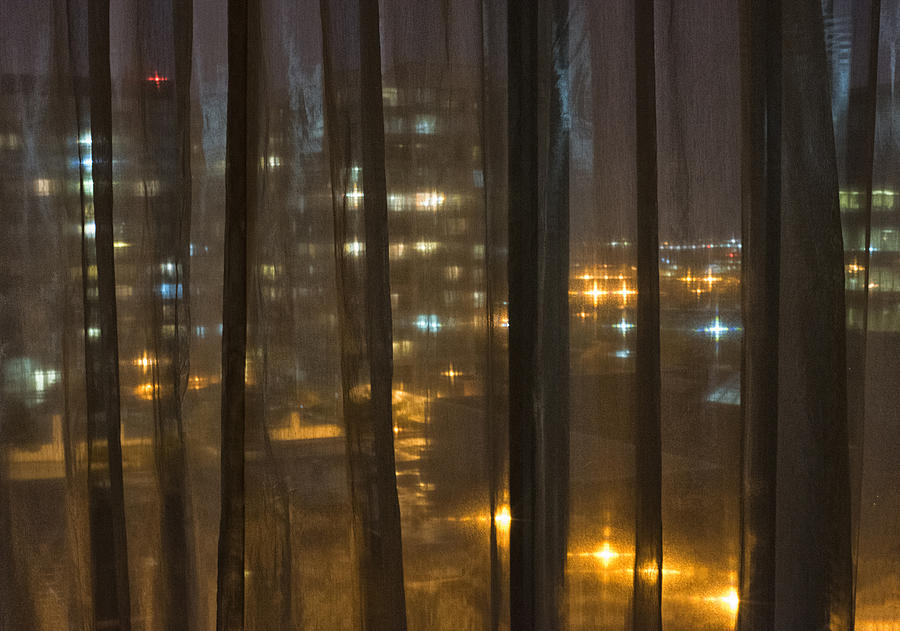 City at night seen through sheer curtains Photograph by Lyn Holly Coorg