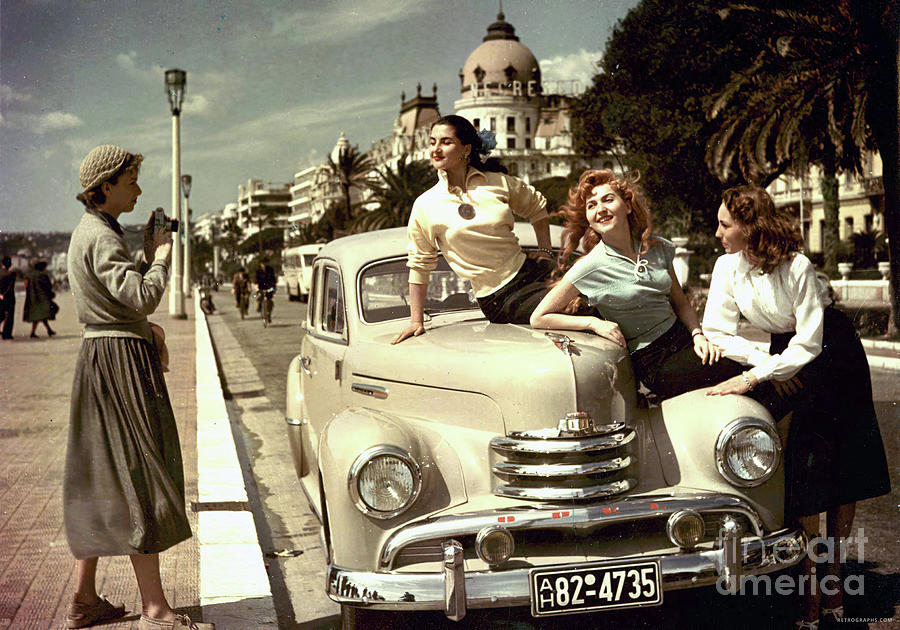 City scene of a group of women with 1951 Opel Photograph by Retrographs