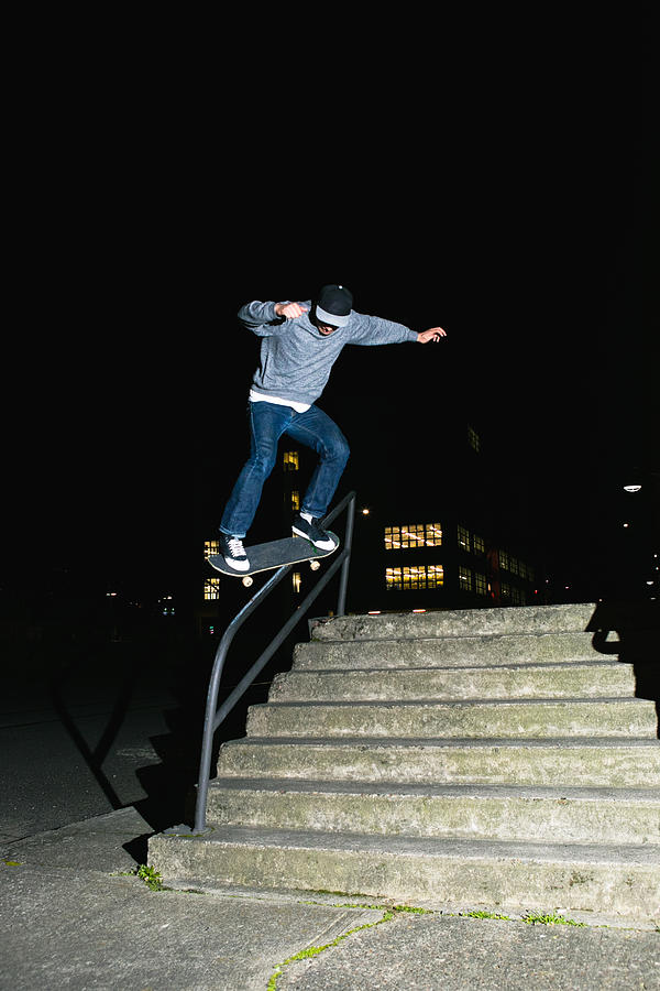 City Skateboarder Skating A Stair Set and Handrail Photograph by Timnewman