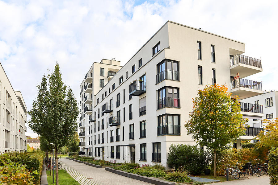 Cityscape with modern residential area, new apartment buildings and green courtyard with pavement and trees in autumn Photograph by by ah_fotobox - Andreas*H Cityscape with modern residential area, new apartment buildings and green courtyard with pavement and trees in autumn Photograph by by ah_fotobox - Andreas*H