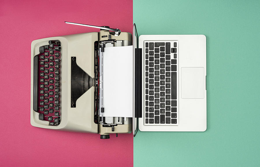 Classic analog typewriter vs Modern digital hi-tech laptop computer Photograph by Pidjoe