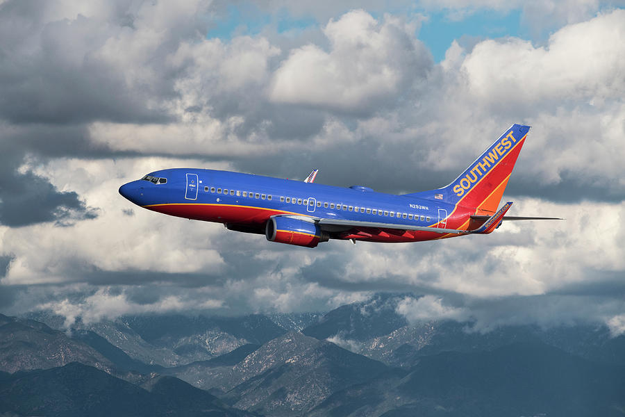 Classic Southwest Airlines Boeing 737 over Mountains Mixed Media by Erik Simonsen