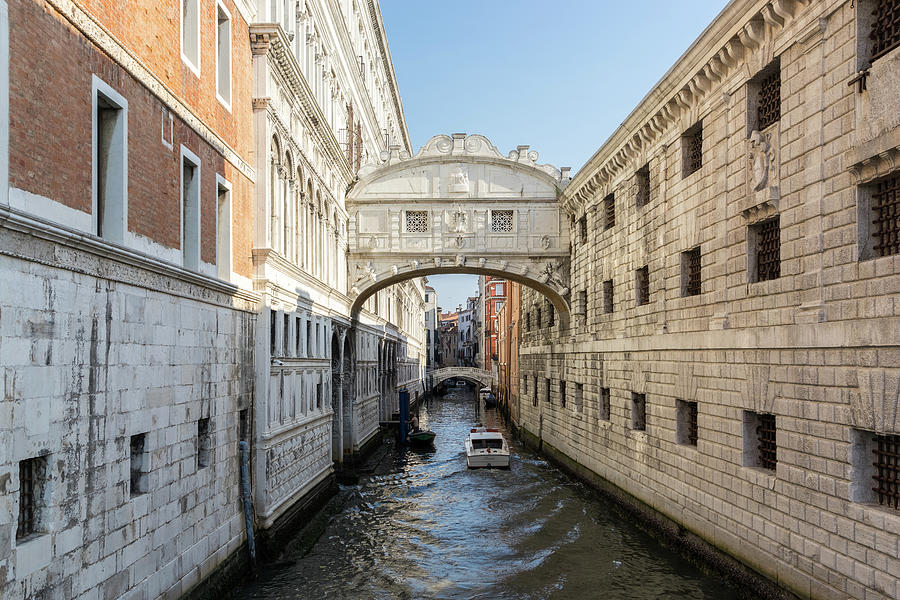 Classic Venetian - a Water Taxi Boat Under the Bridge of Sighs Photograph by Georgia Mizuleva