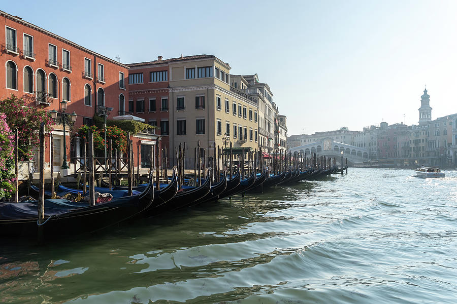Classic Venetian - Glossy Gondolas and Ripples on the Grand Canal Photograph by Georgia Mizuleva